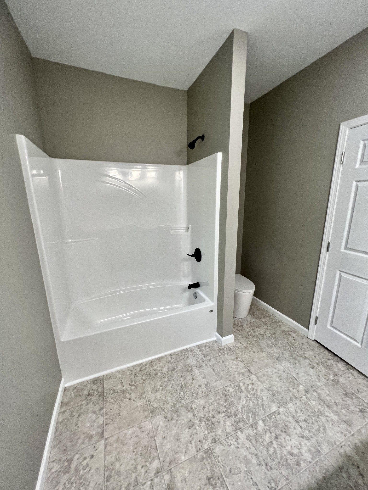 341 Back Bone Road Sparta, TN 38583 - Photo 12 of 21 a bathroom with a bathtub and a shower