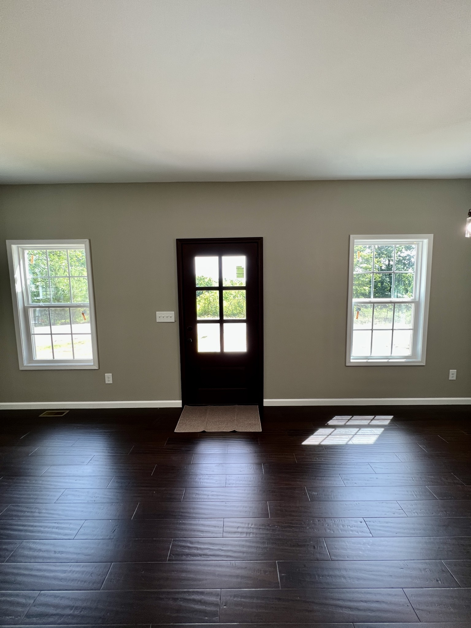 341 Back Bone Road Sparta, TN 38583 - Photo 3 of 21 an empty room with wooden floor and windows