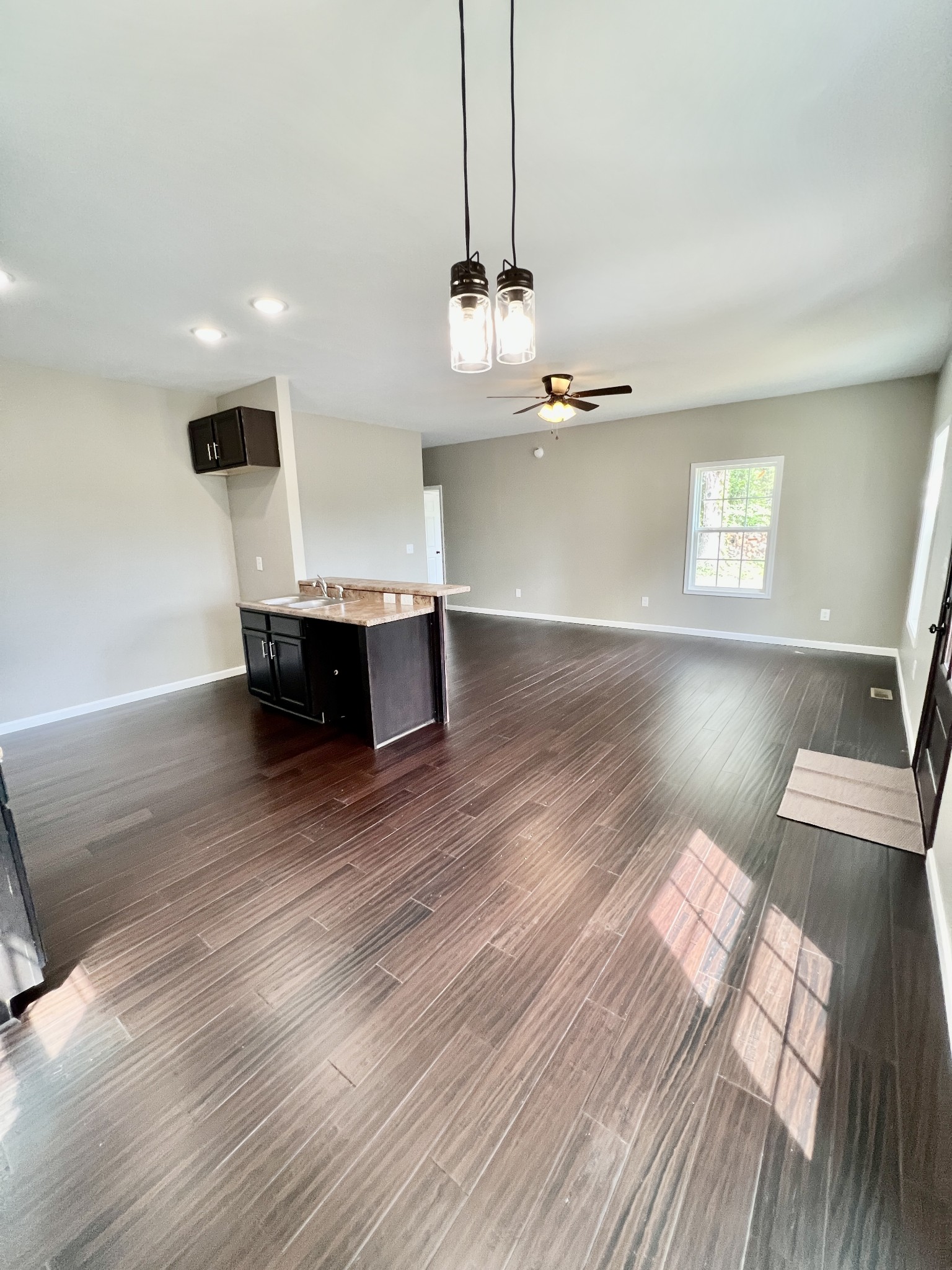 341 Back Bone Road Sparta, TN 38583 - Photo 6 of 21 a view of kitchen and living room with wooden floor