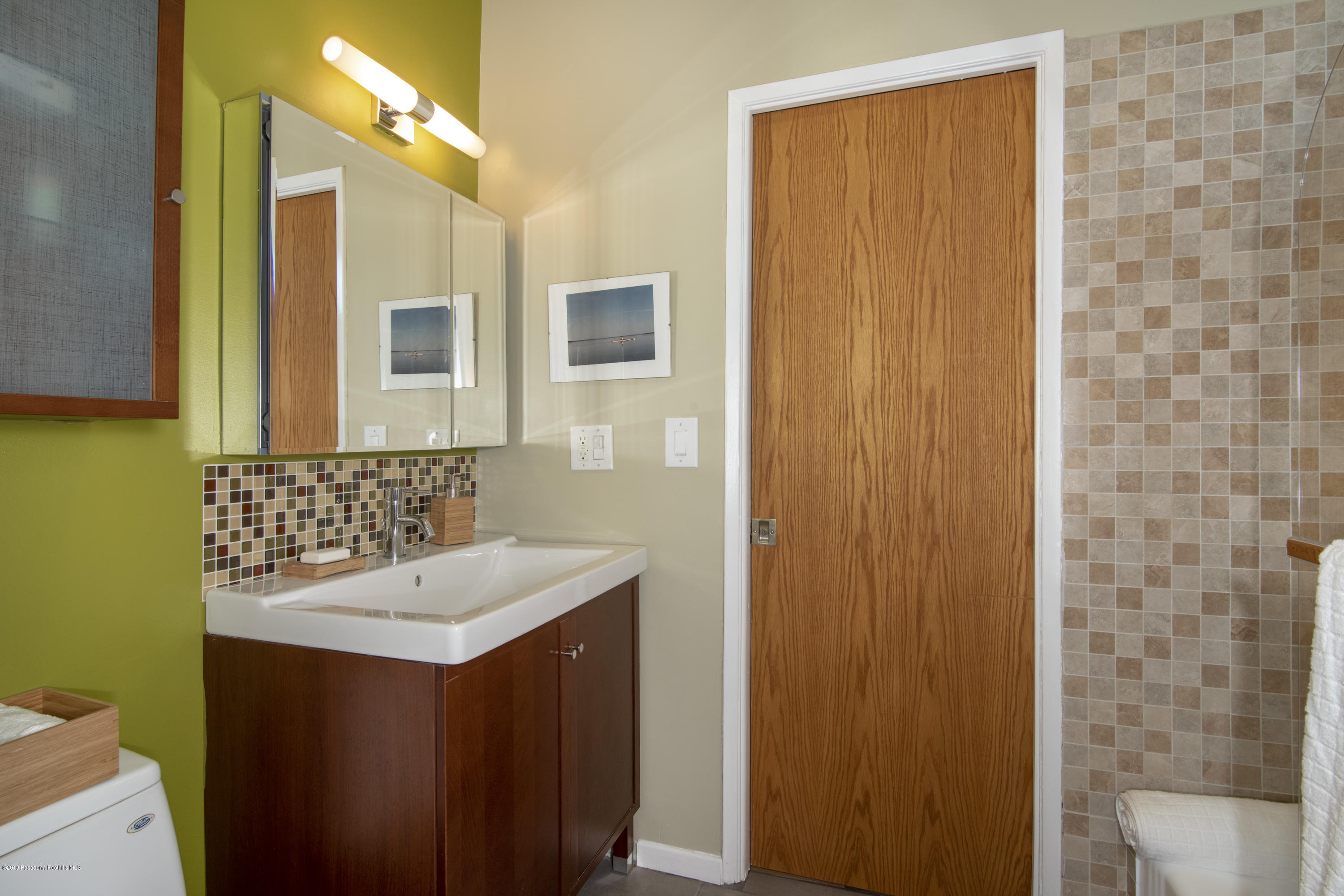 1623 Silverwood Drive Eagle Rock, CA 90041 - Photo 15 of 24 a bathroom with a sink and a mirror
