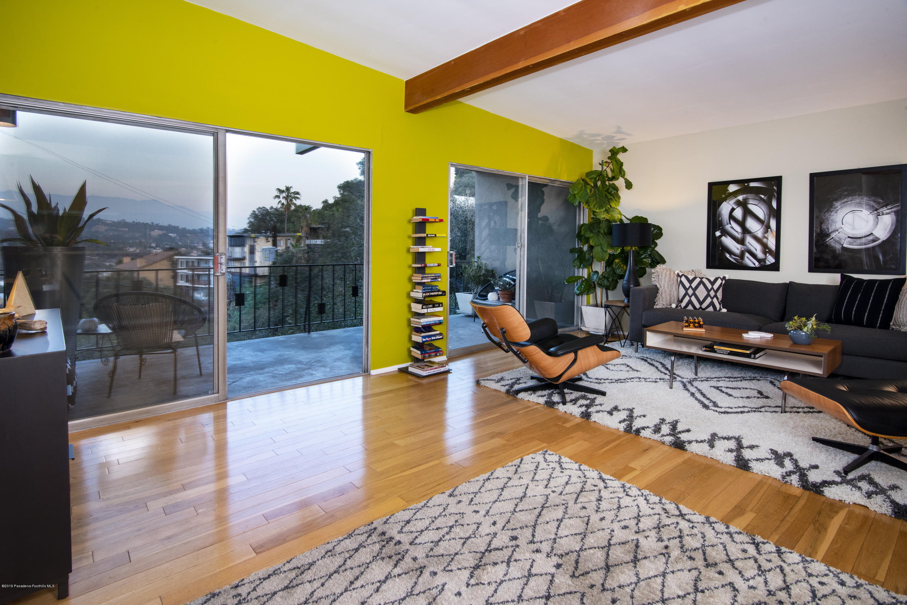 1623 Silverwood Drive Eagle Rock, CA 90041 - Photo 3 of 24 a living room with patio furniture and a floor to ceiling window