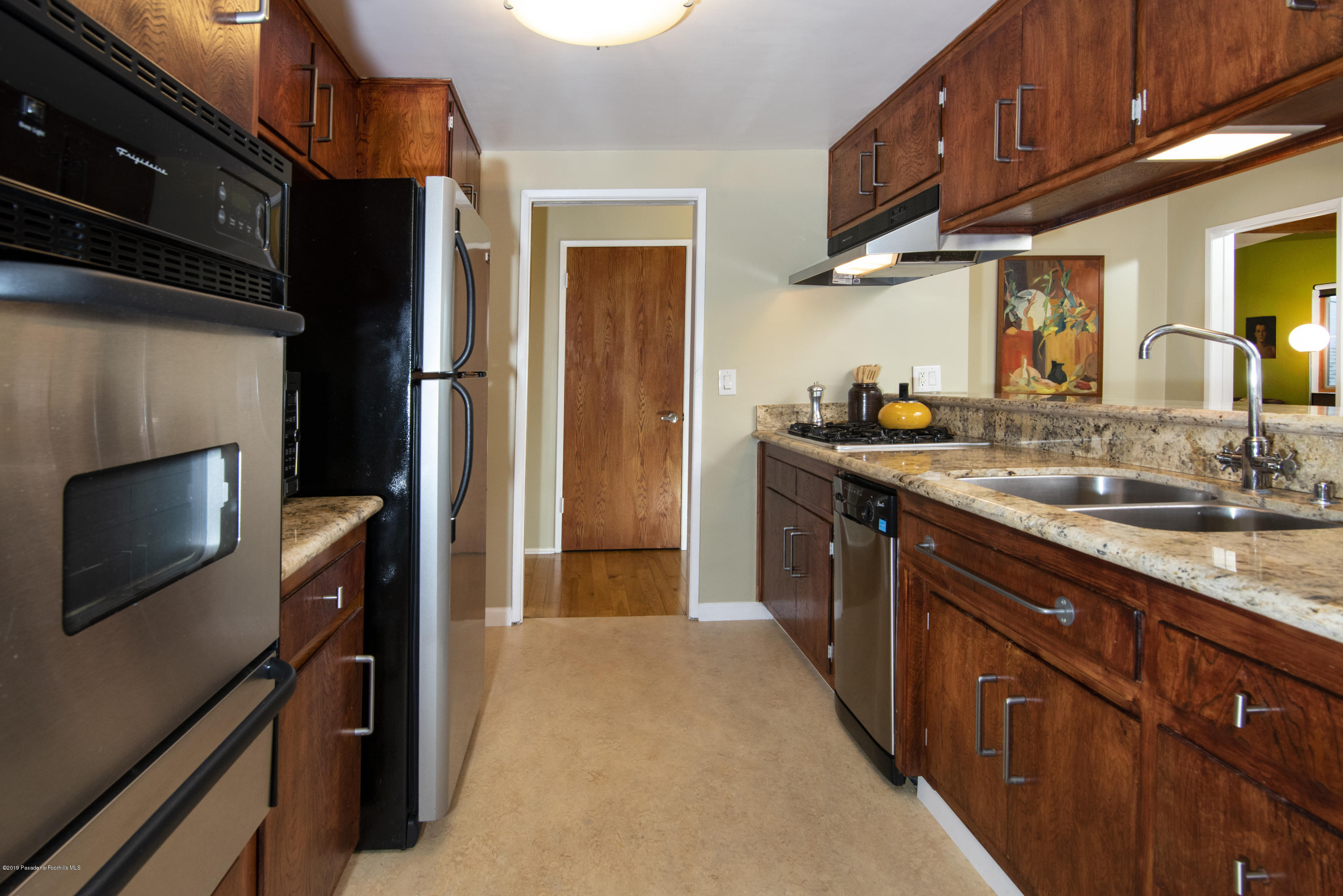 1623 Silverwood Drive Eagle Rock, CA 90041 - Photo 6 of 24 a kitchen with granite countertop a sink stove and refrigerator