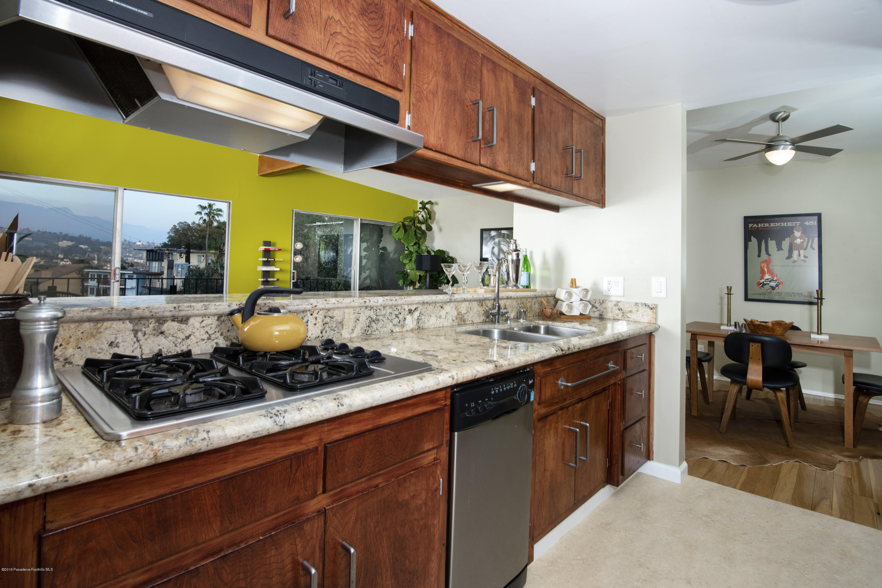 1623 Silverwood Drive Eagle Rock, CA 90041 - Photo 7 of 24 a kitchen with stainless steel appliances a stove a sink and a dining table