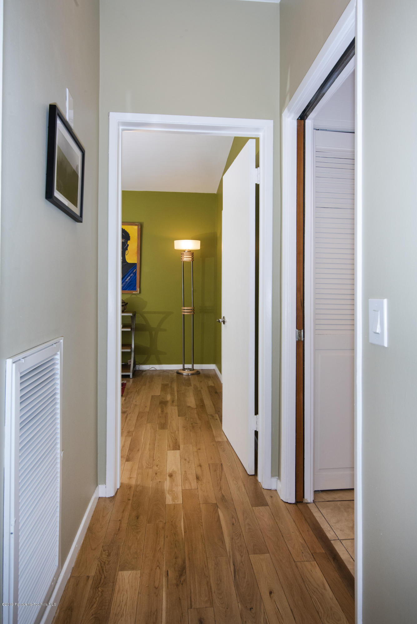 1623 Silverwood Drive Eagle Rock, CA 90041 - Photo 10 of 24 a view of a hallway with wooden floor and a bathroom