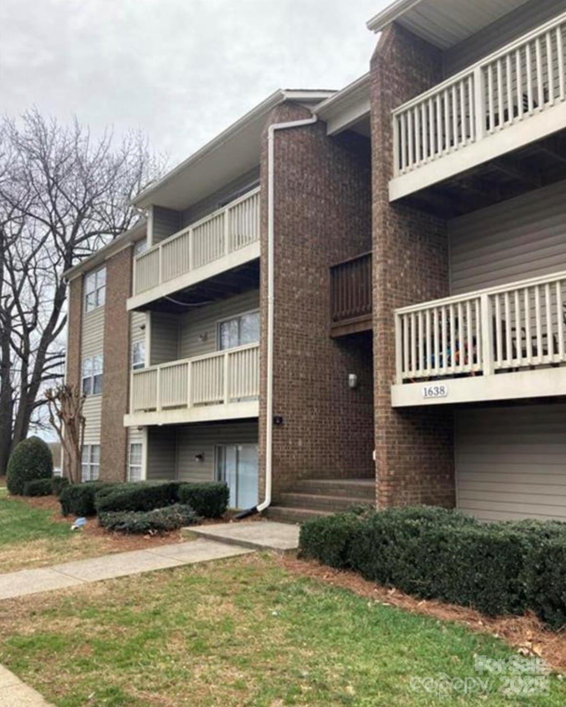 1624 Arlyn Circle, Unit G Charlotte, NC 28213 - Photo 13 of 13 a view of a house with a balcony