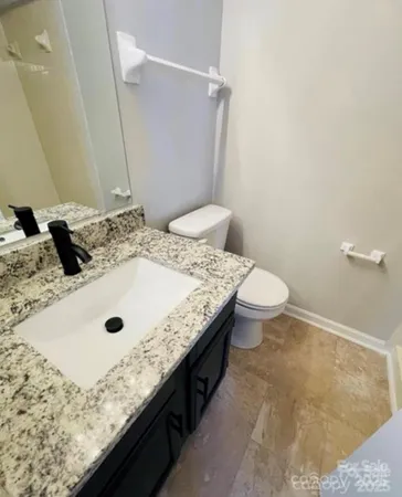 an empty room with wooden floor and door