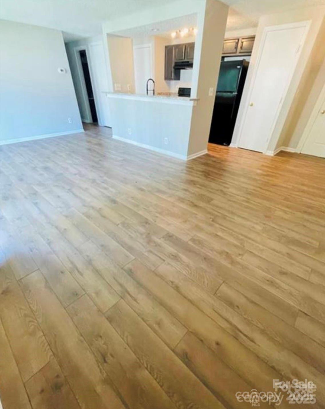 1624 Arlyn Circle, Unit G Charlotte, NC 28213 - Photo 10 of 13 a view of a kitchen with wooden floor and a sink