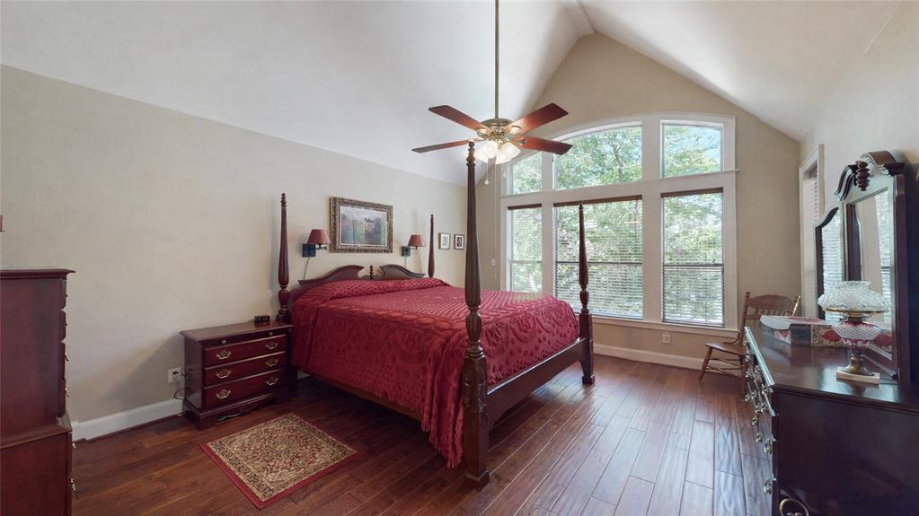7451 County Road 1509 Athens, TX 75751 - Photo 9 of 36 a spacious bedroom with a bed and a large window