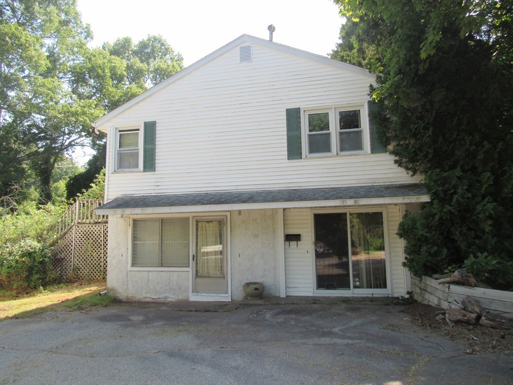 5 Capt Peter Simpson Road Millbury, MA 01527 - Photo 6 of 35 a front view of a house with a garage