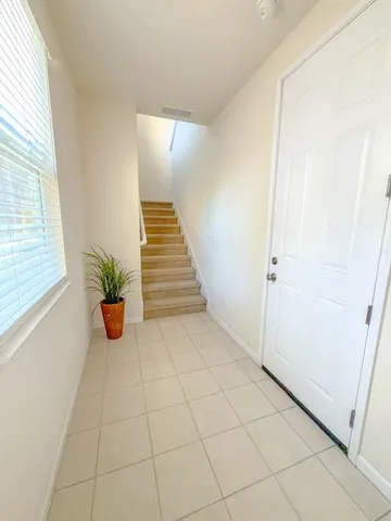 a view of an entryway with wooden floor