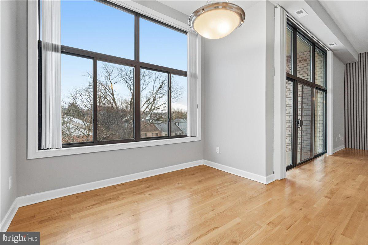 10860-10864 Bucknell Drive, Unit 301 Silver Spring, MD 20902 - Photo 12 of 24 a view of empty room with a large window