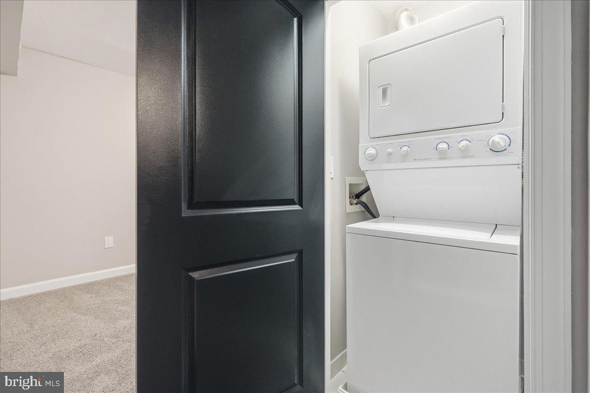 10860-10864 Bucknell Drive, Unit 301 Silver Spring, MD 20902 - Photo 16 of 24 a utility room with dryer and washer