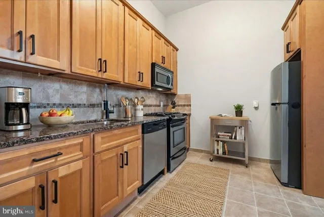 a dining room with furniture wooden floor and a rug