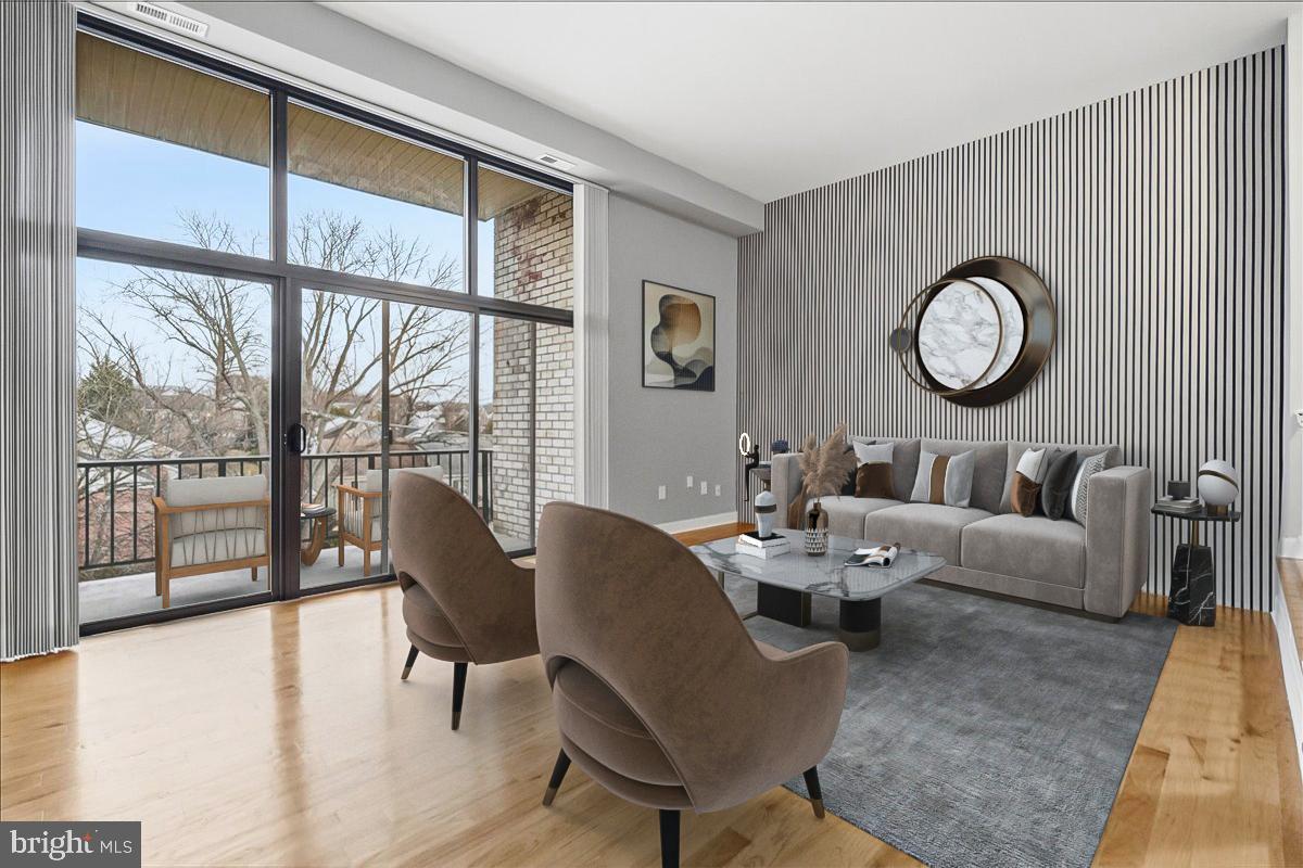 10860-10864 Bucknell Drive, Unit 301 Silver Spring, MD 20902 - Photo 4 of 24 a dining room with furniture wooden floor and a rug