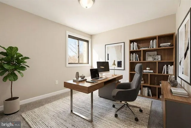 a view of a room that has a large window