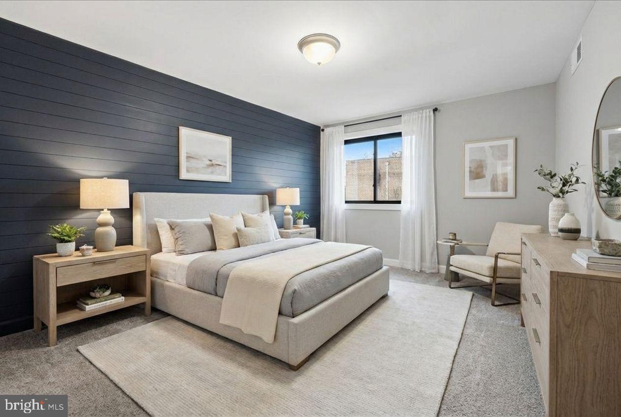 10860-10864 Bucknell Drive, Unit 301 Silver Spring, MD 20902 - Photo 6 of 24 a spacious bedroom with a bed and window