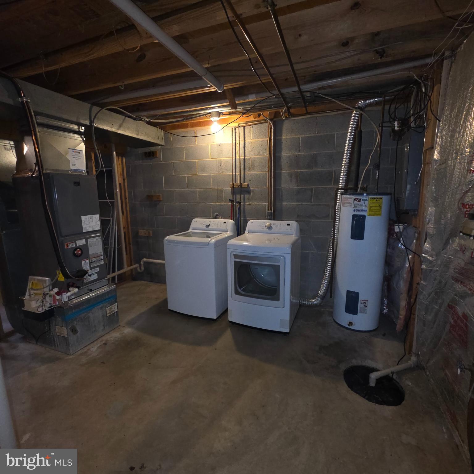 1758 Springfield Lane Frederick, MD 21702 - Photo 15 of 31 a view of a storage room with washer and dryer
