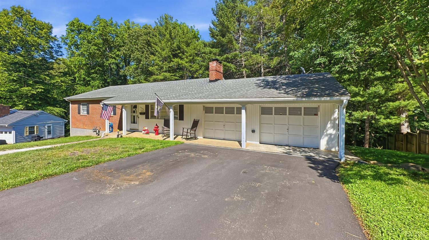 2044 Indian Hill Road Lynchburg, VA 24503 - Photo 2 of 30 a front view of a house with a garden and trees