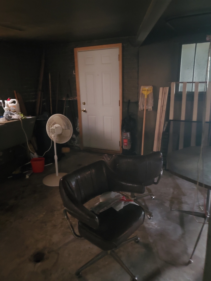 8238 South Rhodes Avenue Chicago, IL 60619 - Photo 5 of 5 a living room with furniture