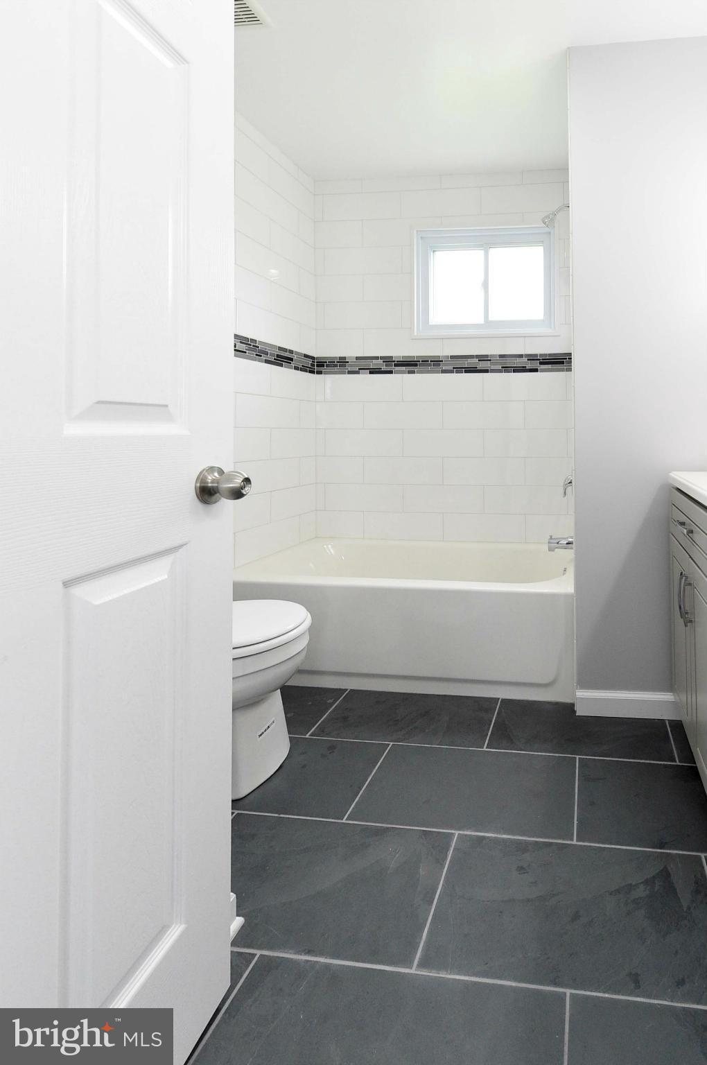 3822 Byfield Road Baltimore, MD 21207 - Photo 13 of 30 a bathroom with a toilet and a shower