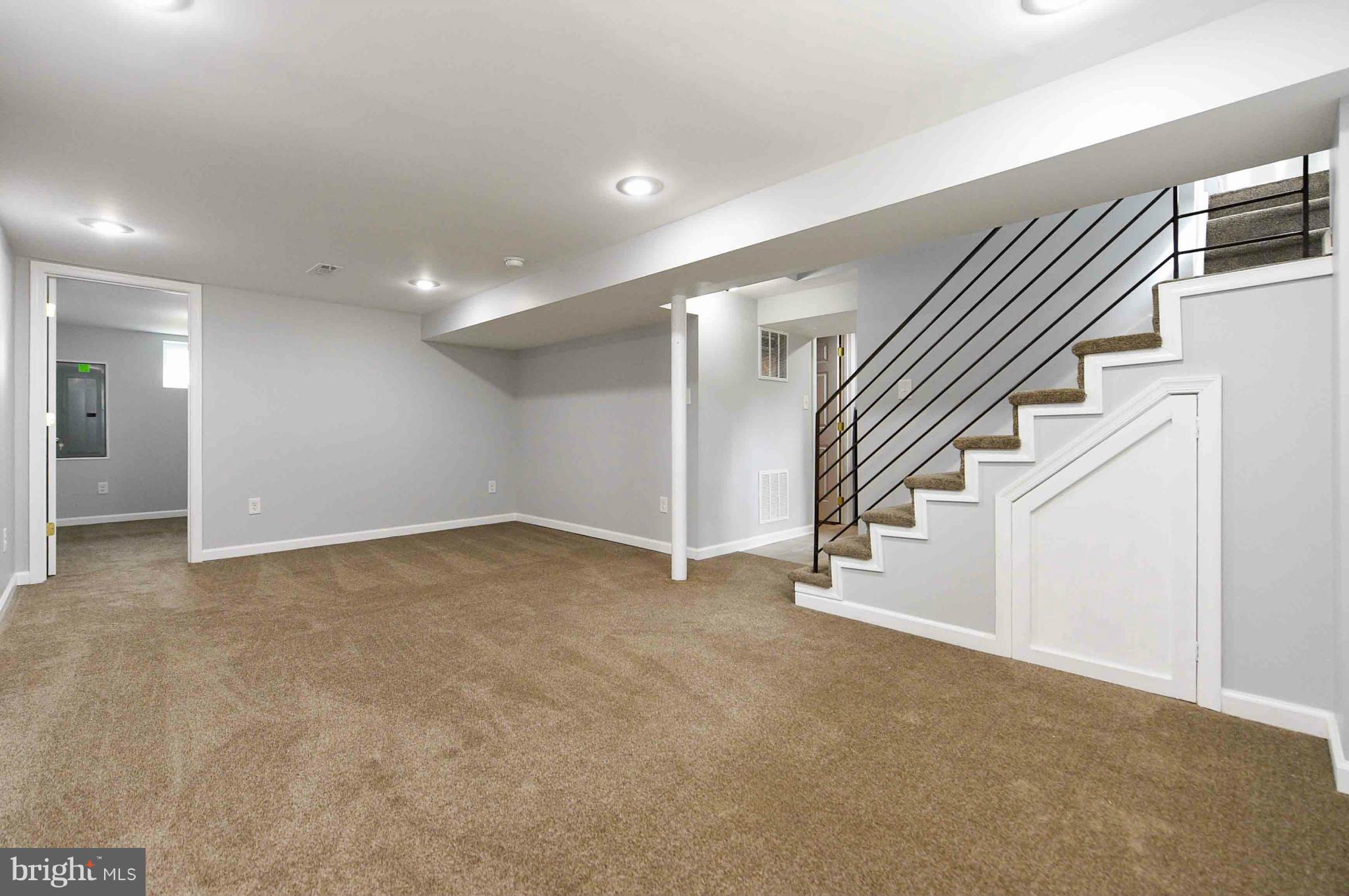 3822 Byfield Road Baltimore, MD 21207 - Photo 22 of 30 a view of an empty room with stairs