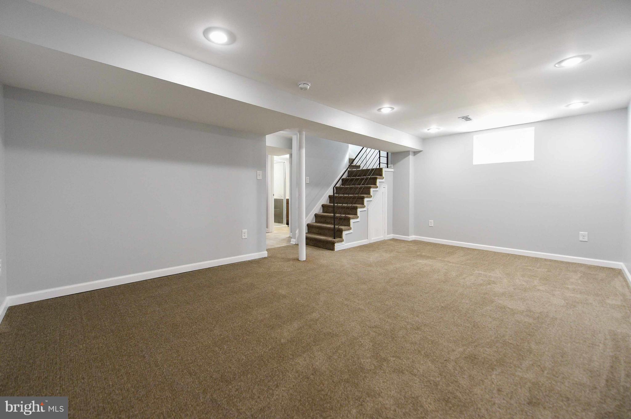 3822 Byfield Road Baltimore, MD 21207 - Photo 23 of 30 an empty room with stairs and stairs