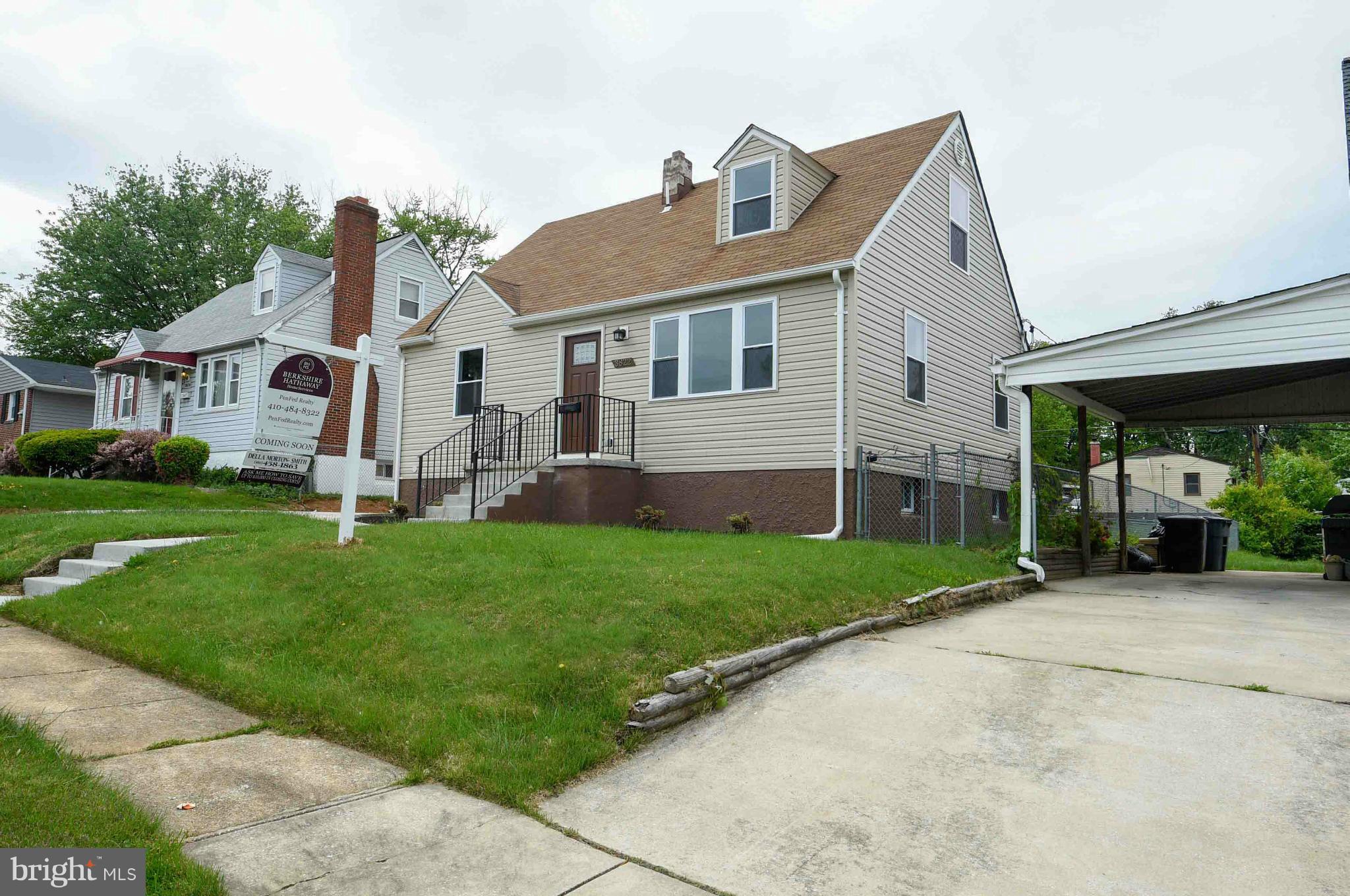 3822 Byfield Road Baltimore, MD 21207 - Photo 29 of 30 a front view of a house with a yard and porch