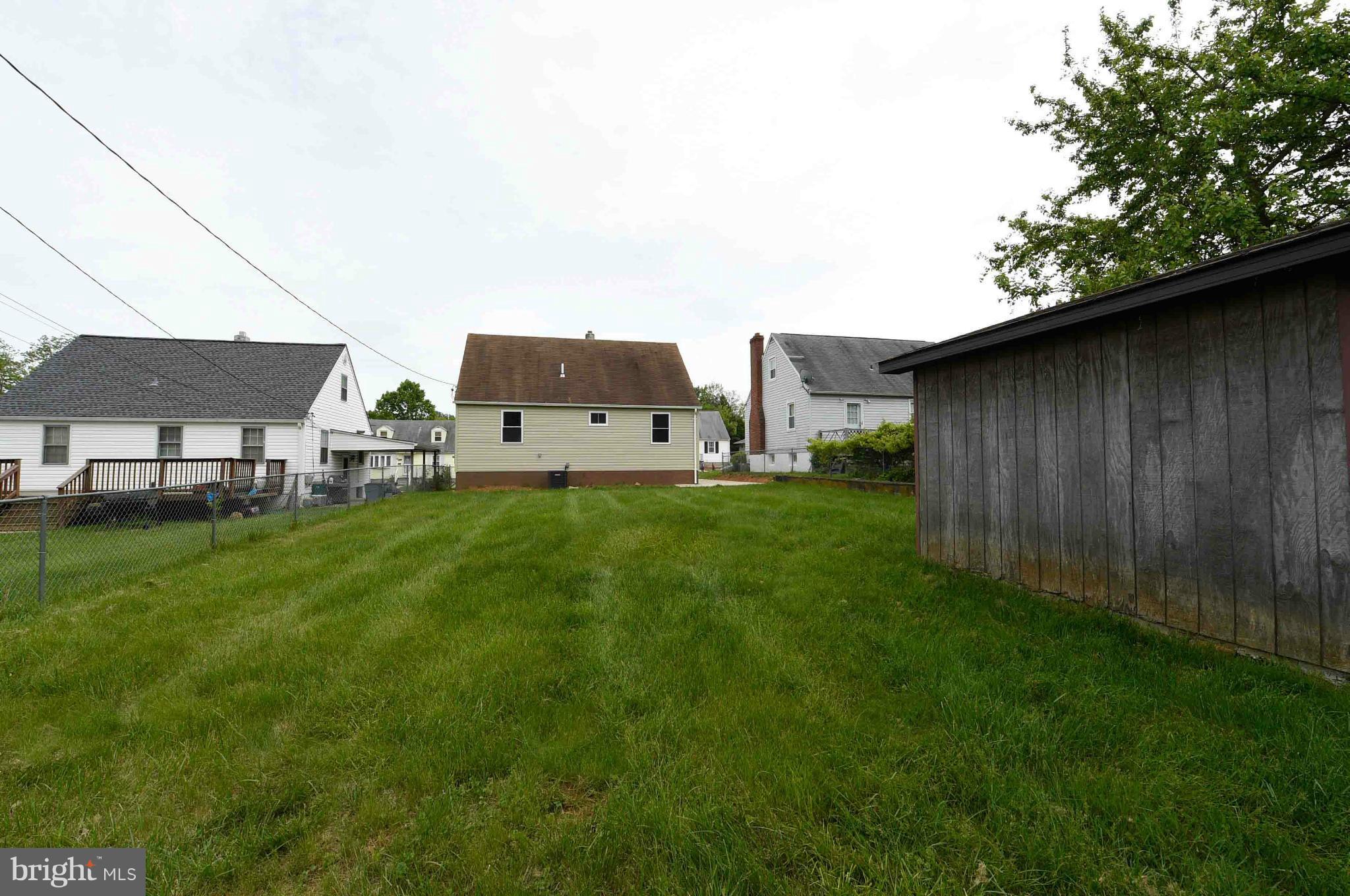 3822 Byfield Road Baltimore, MD 21207 - Photo 30 of 30 a backyard of a house with lots of green space