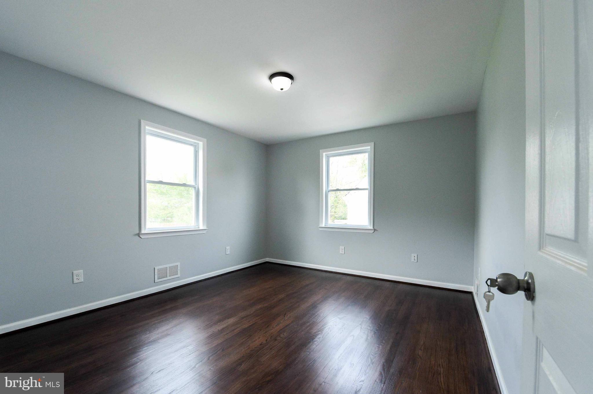 3822 Byfield Road Baltimore, MD 21207 - Photo 9 of 30 a view of a room with wooden floor and windows