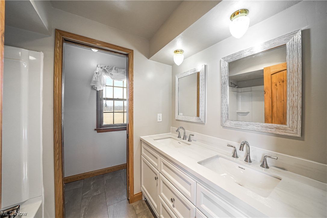 10258 Gilbert Road Newton Falls, OH 44444 - Photo 13 of 37 Bathroom with dual bowl vanity and tile flooring