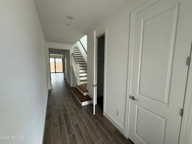 a kitchen with stainless steel appliances a refrigerator and a stove top oven