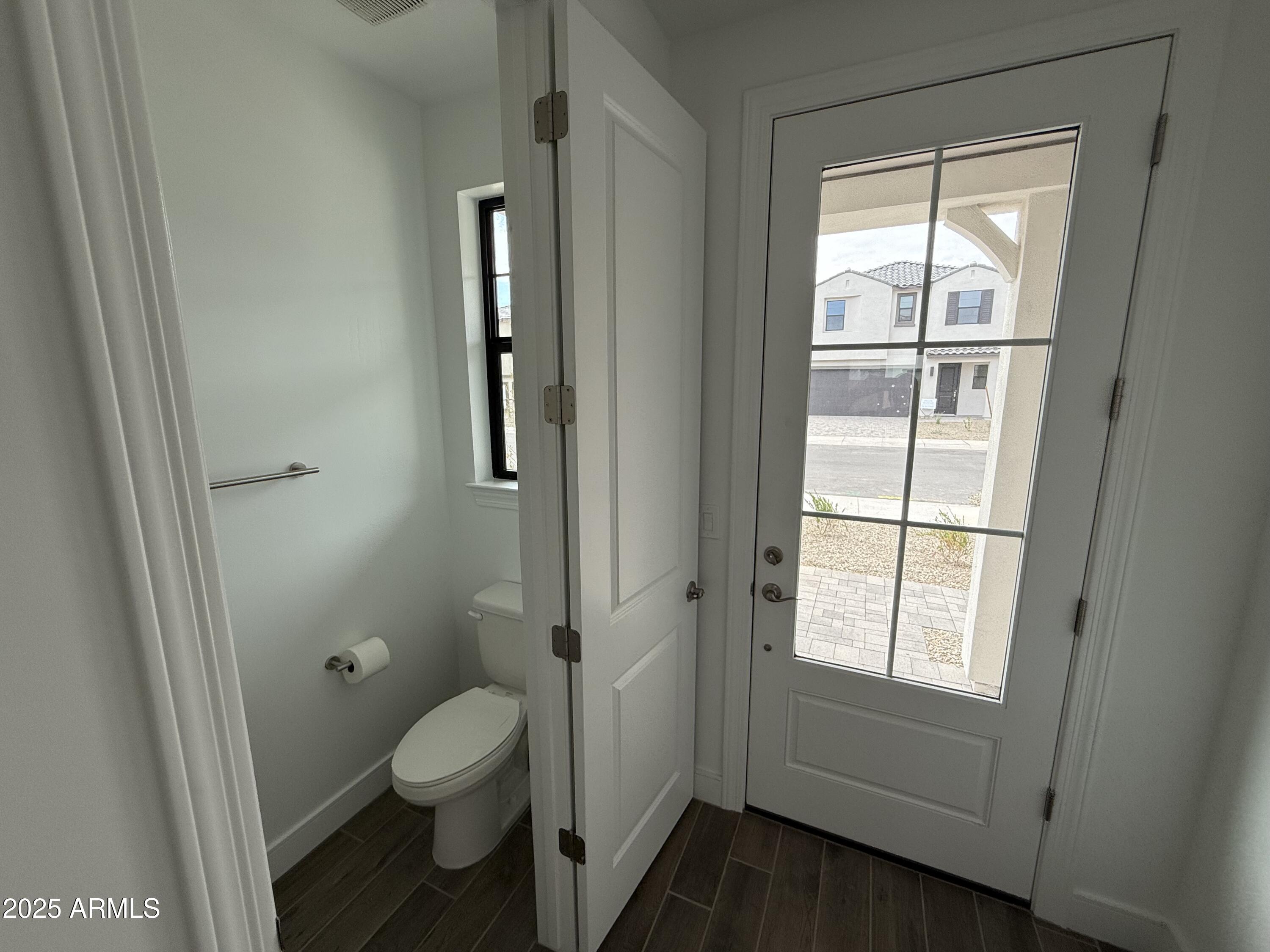 2390 West Los Arboles Place Chandler, AZ 85224 - Photo 10 of 41 a bathroom with a toilet and a shower