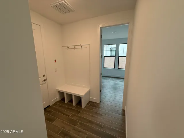 a view of entryway with wooden floor