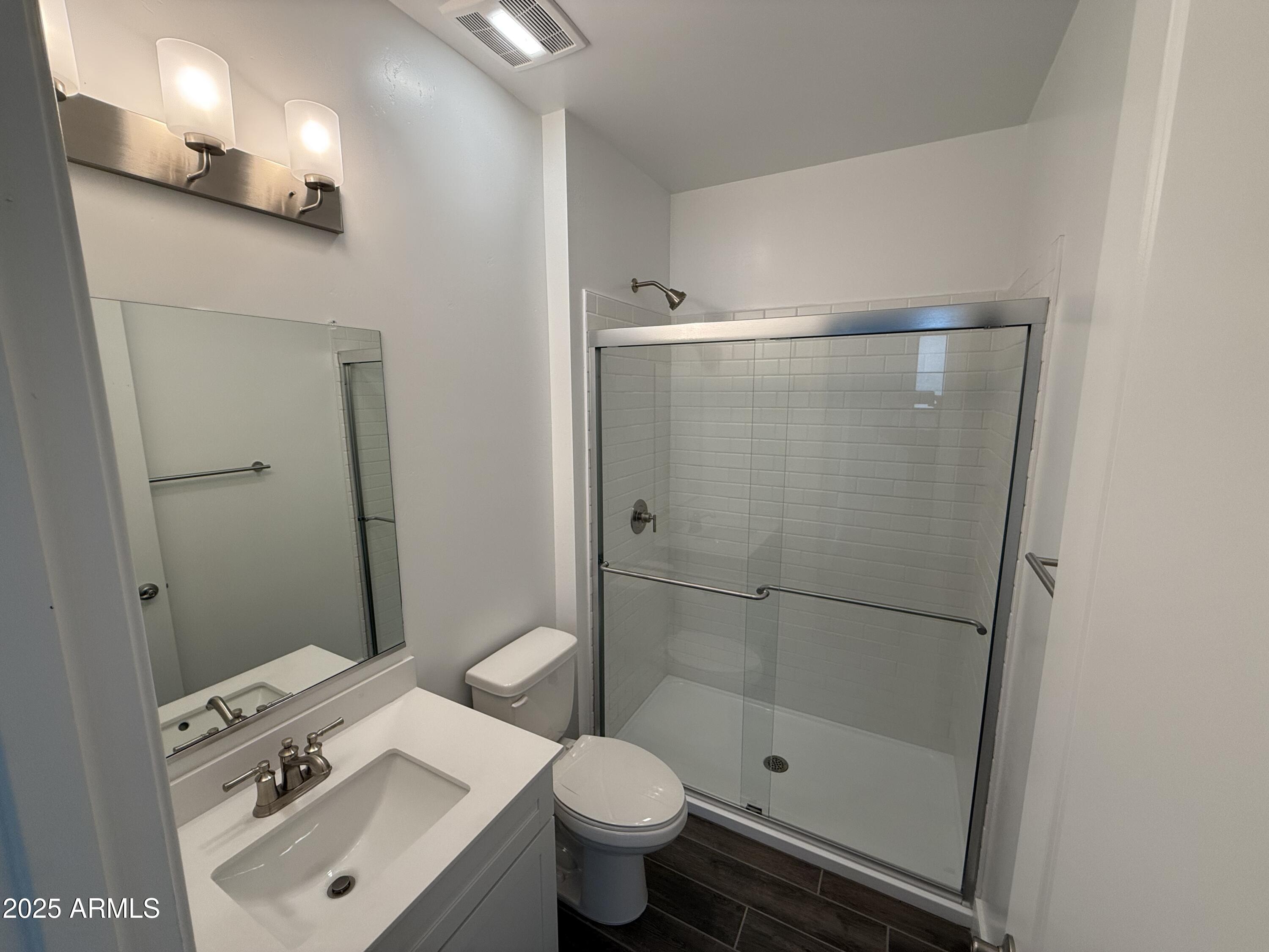 2390 West Los Arboles Place Chandler, AZ 85224 - Photo 16 of 41 a bathroom with a sink toilet and shower