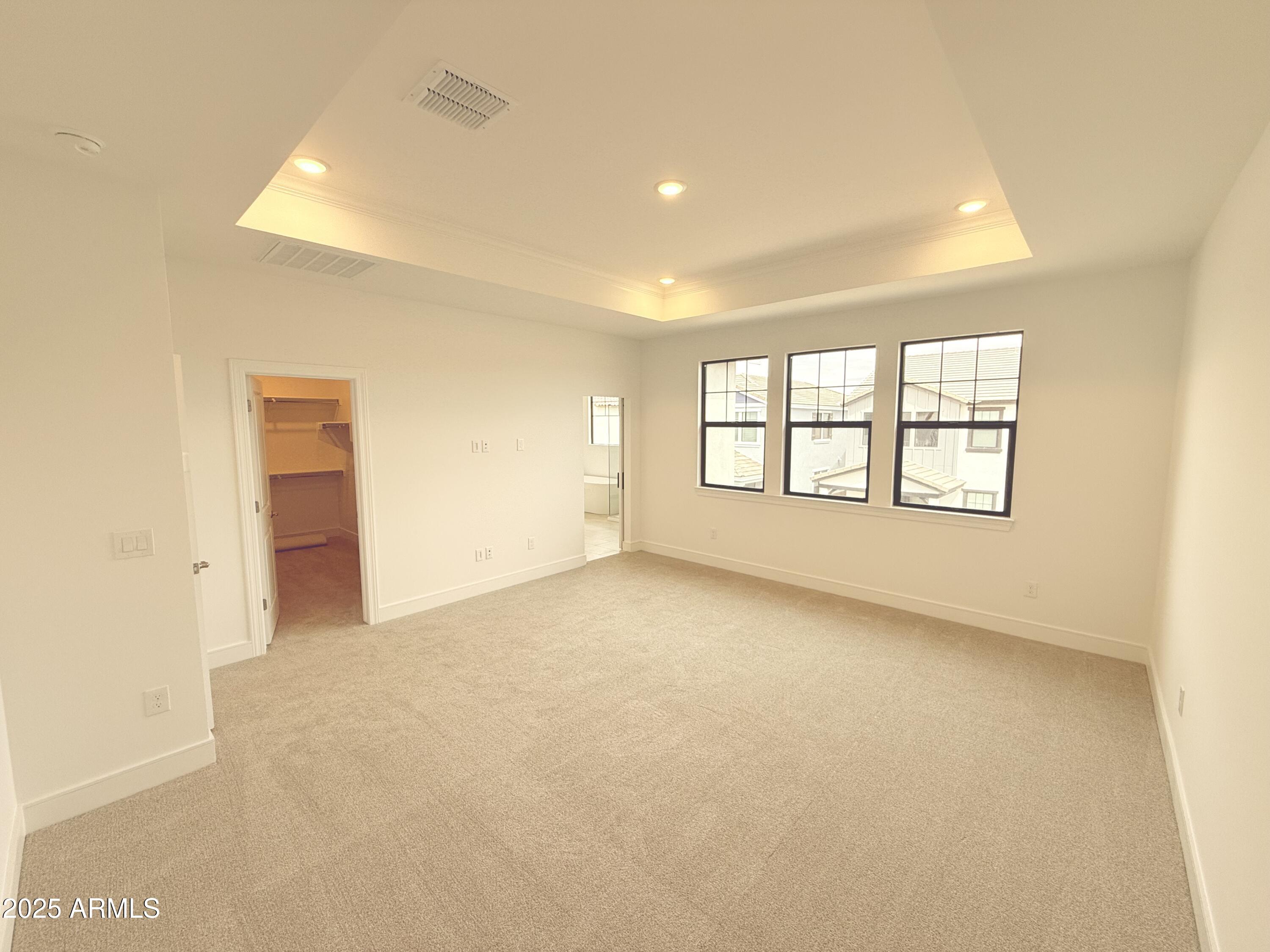 2390 West Los Arboles Place Chandler, AZ 85224 - Photo 20 of 41 an empty room with windows and closet