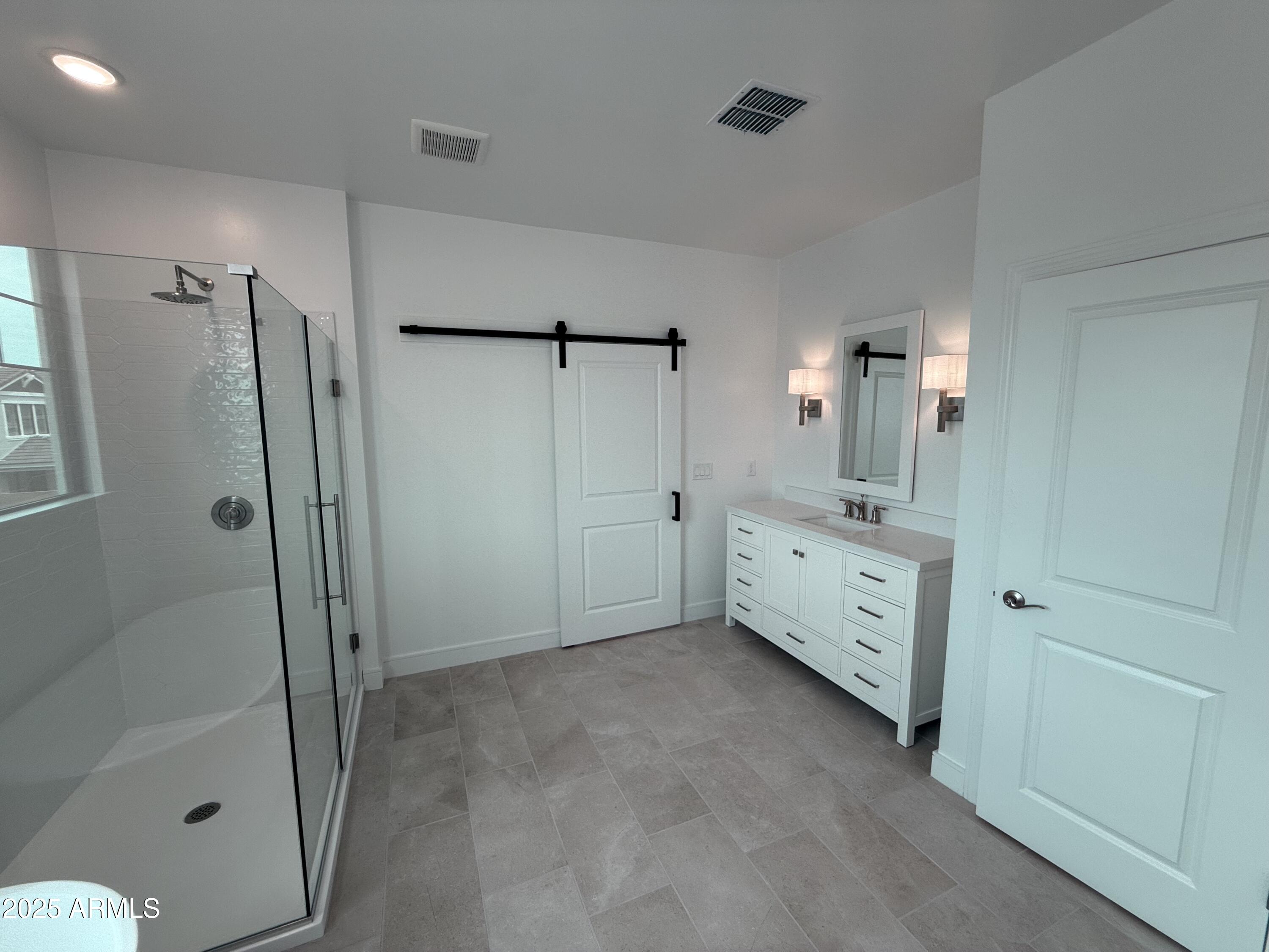 2390 West Los Arboles Place Chandler, AZ 85224 - Photo 26 of 41 a bathroom with a double vanity sink toilet and shower