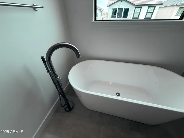 a bathroom with a double vanity sink toilet and shower