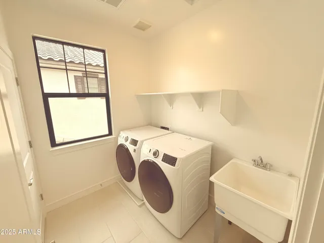 a white bath tub sitting next to a window