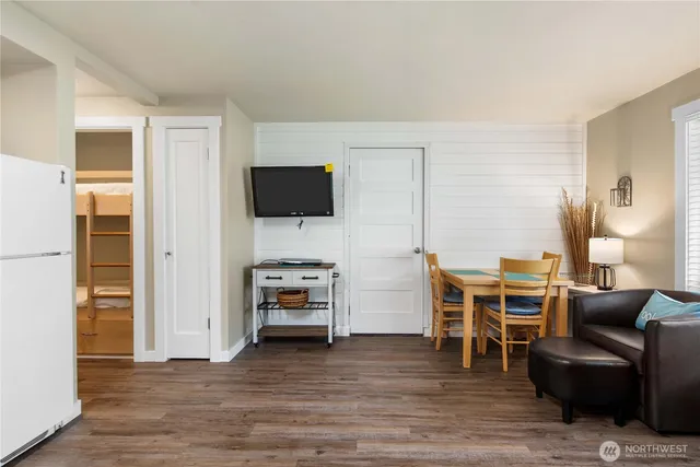 a view of a livingroom with furniture and an empty room