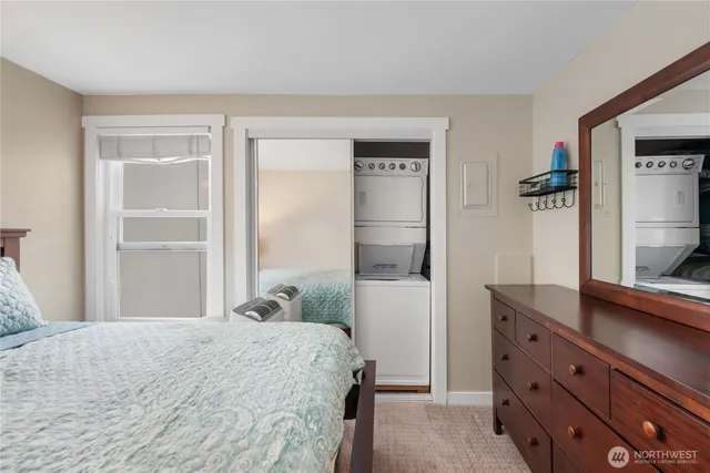 a bedroom with a bed and a dresser