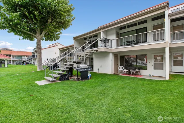 a view of a house with a yard porch and sitting area