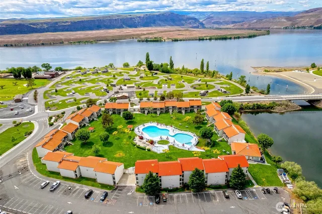 an aerial view of a house with a lake view