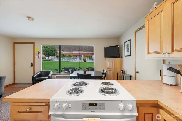 a kitchen with a stove a sink and a refrigerator