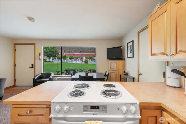 a kitchen with a stove a sink and a refrigerator