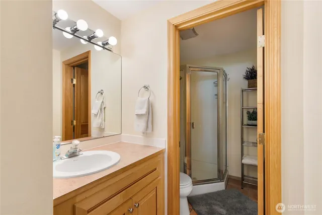 a bathroom with a sink a light fixture and a mirror
