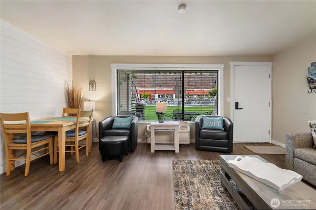 a living room with furniture and a large window