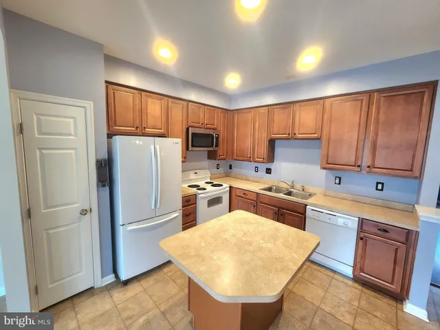 a view of a kitchen with furniture and chandelier
