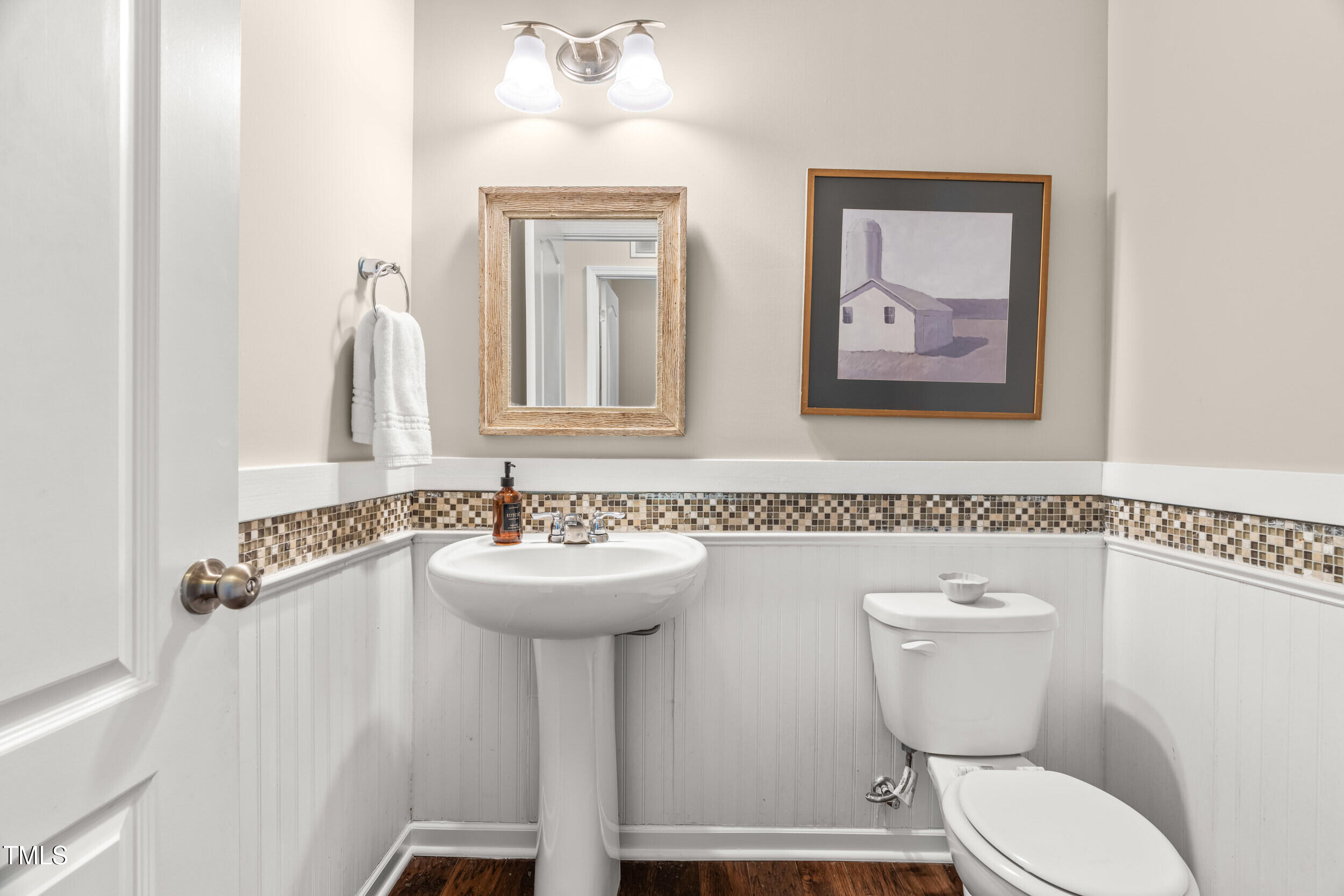 1304 Ivey Grove Court Fuquay-Varina, NC 27526 - Photo 18 of 44 a bathroom with a toilet sink and mirror