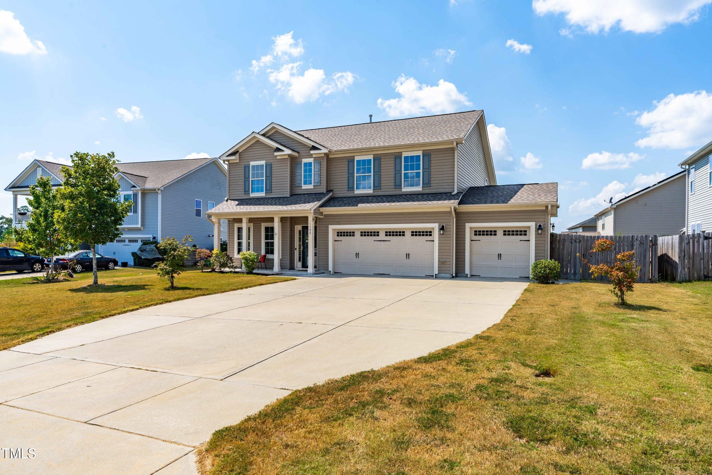 1304 Ivey Grove Court Fuquay-Varina, NC 27526 - Photo 2 of 44 a front view of house with yard