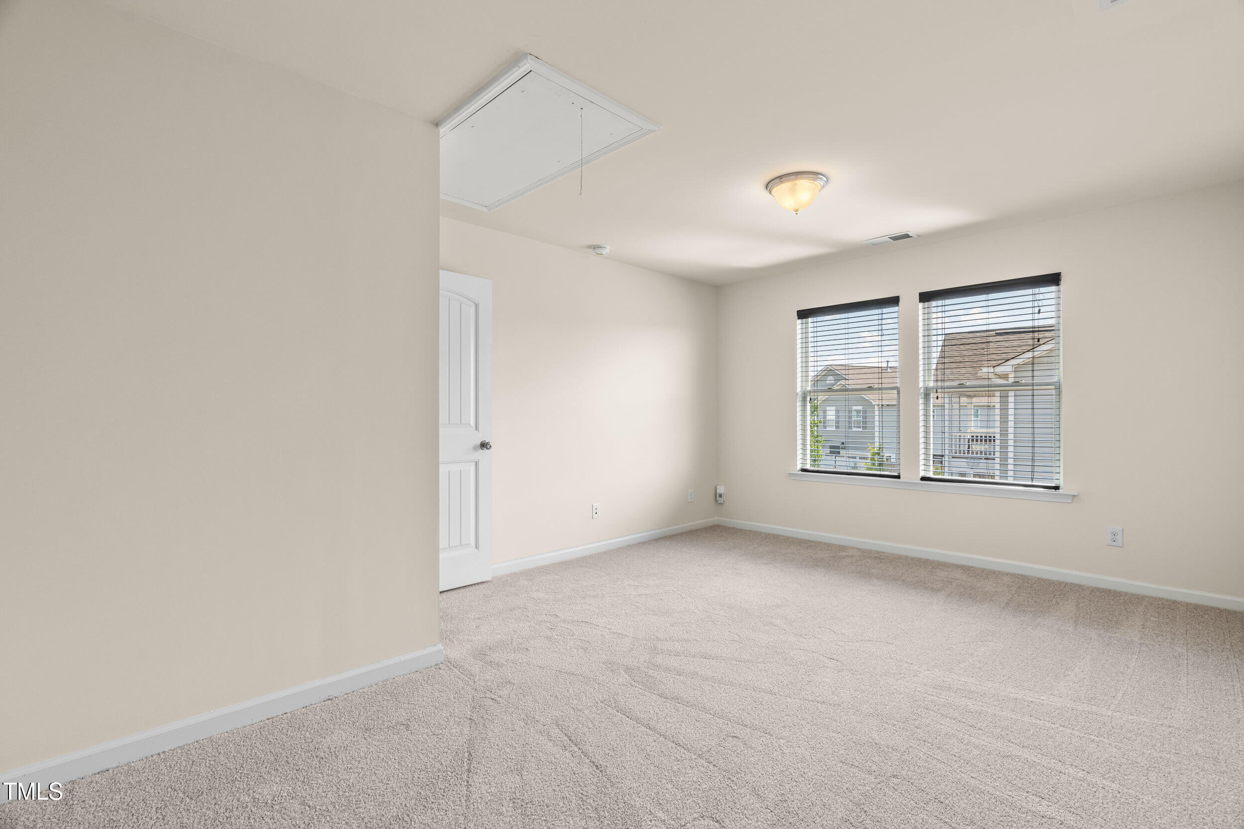 1304 Ivey Grove Court Fuquay-Varina, NC 27526 - Photo 26 of 44 an empty room with windows